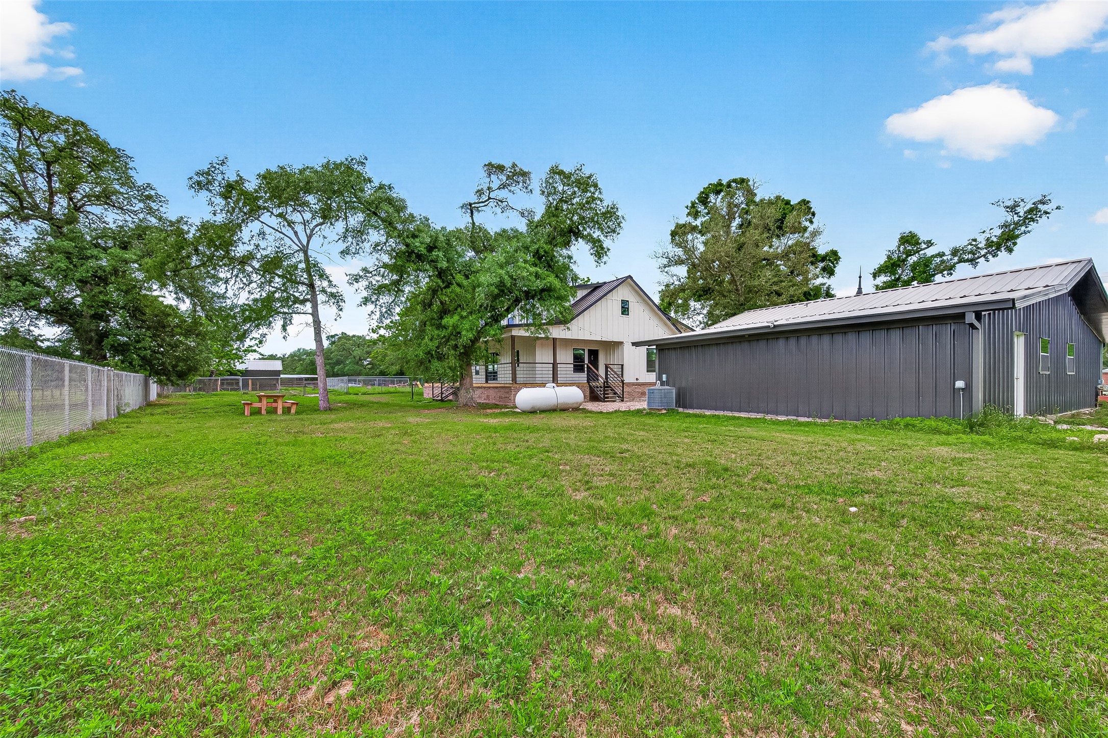 803 County Road 772 Damon, TX 77430 - Photo 40 of 50 a front view of a house with garden