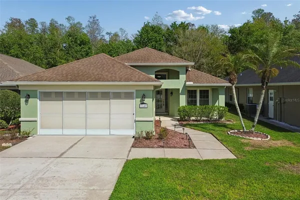 a front view of a house with a yard and porch