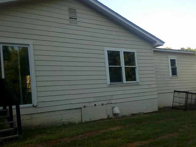 a view of backyard with a chair