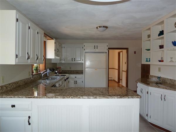 795 Liberty Square Road Boxborough, MA 01719 - Photo 5 of 20 a kitchen with refrigerator and cabinets