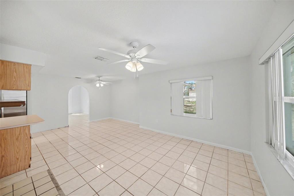 113 Ruskin Avenue Spring Hill, FL 34606 - Photo 13 of 32 an empty room with windows and fan