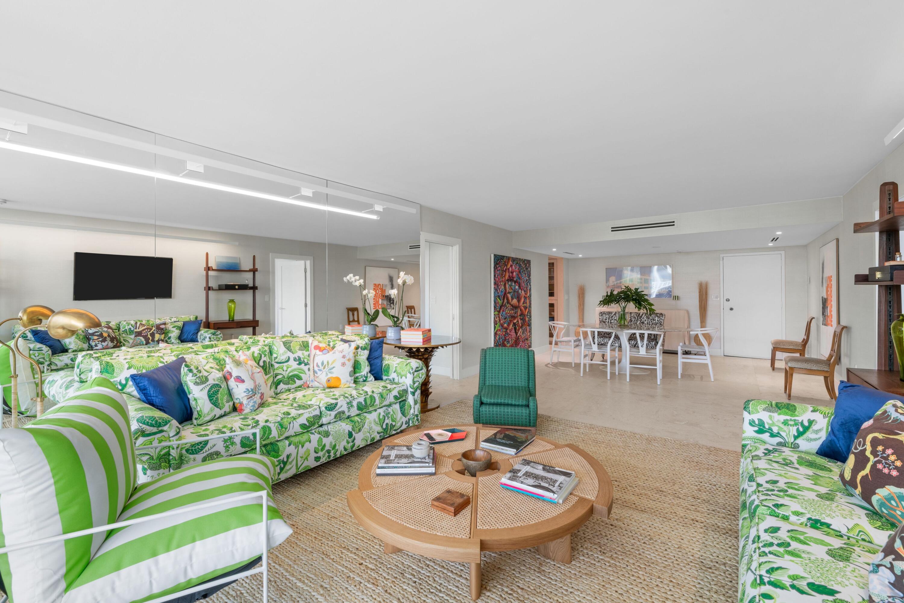 2773 South Ocean Boulevard, Unit 209 Palm Beach, FL 33480 - Photo 12 of 30 a living room with furniture and a flat screen tv