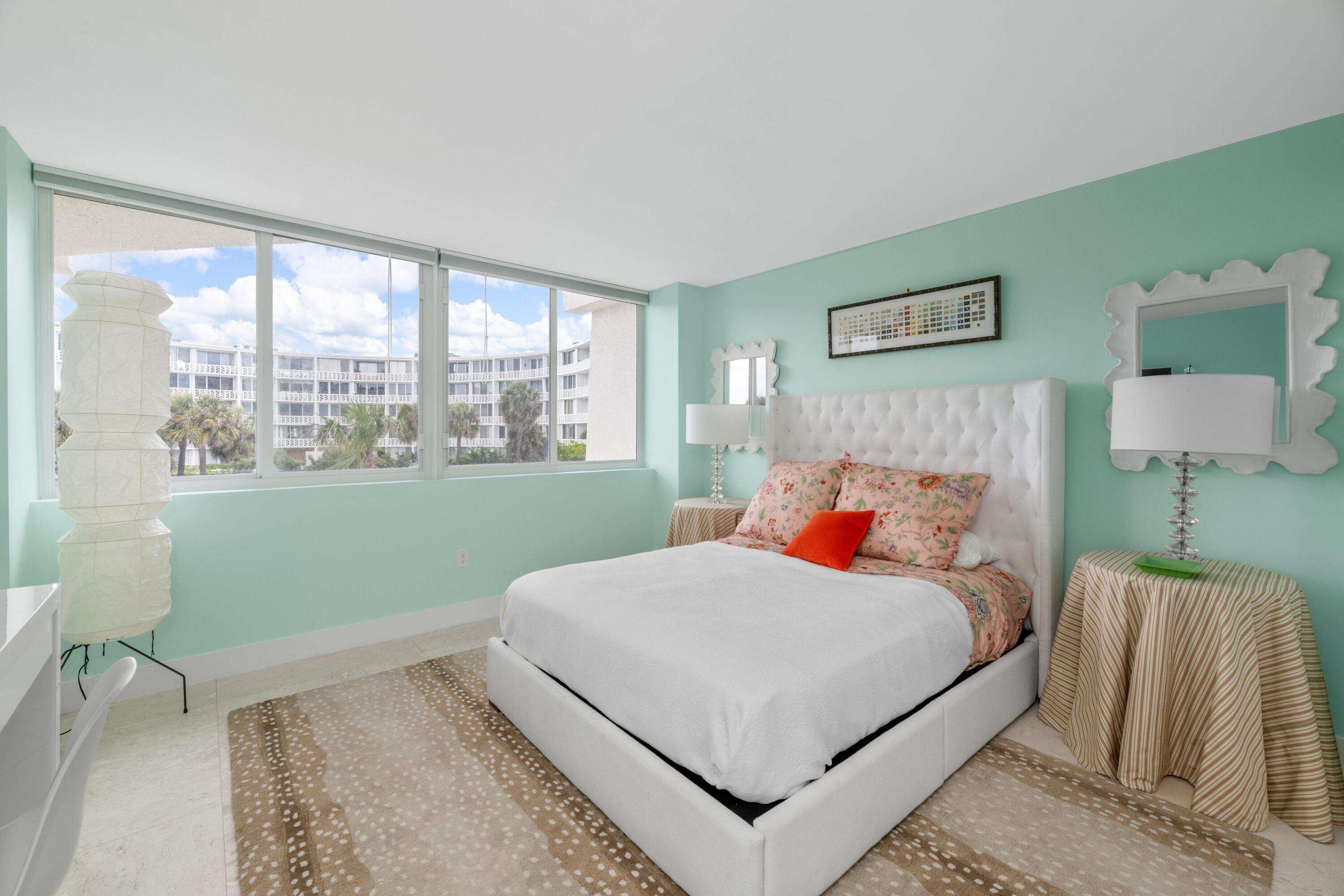 2773 South Ocean Boulevard, Unit 209 Palm Beach, FL 33480 - Photo 17 of 30 a bedroom with a bed and a table