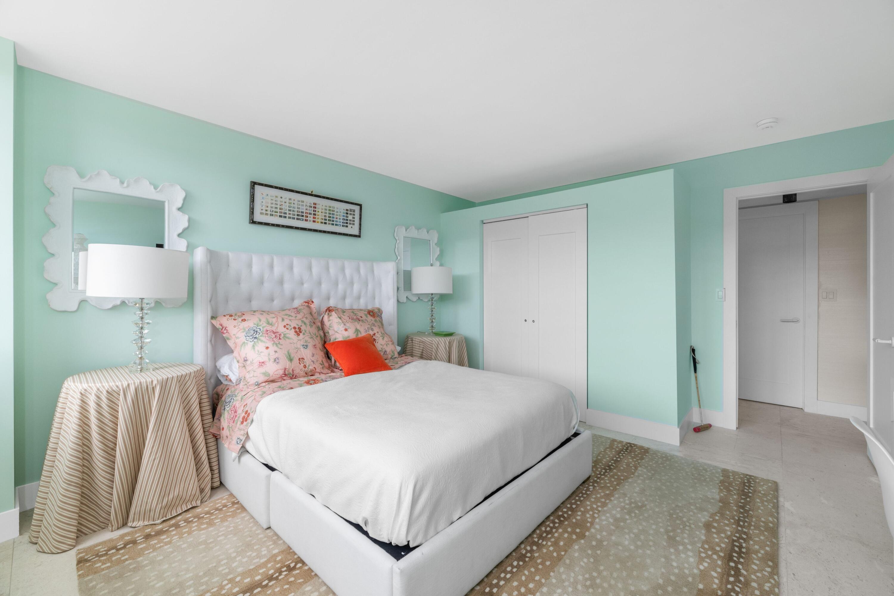 2773 South Ocean Boulevard, Unit 209 Palm Beach, FL 33480 - Photo 18 of 30 a bedroom with a bed and a lamp