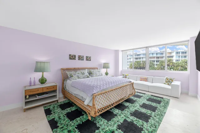 a bedroom with bed and a night stand