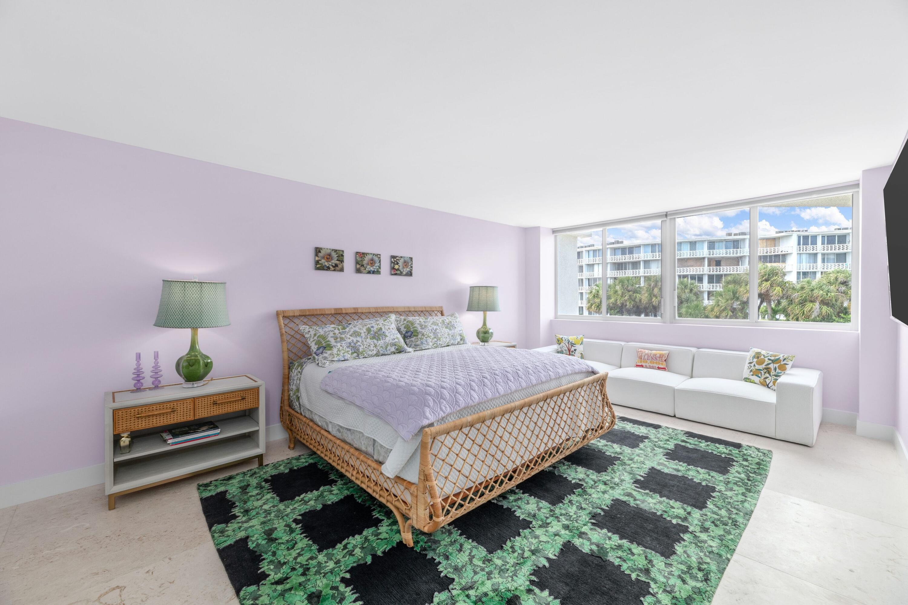 2773 South Ocean Boulevard, Unit 209 Palm Beach, FL 33480 - Photo 21 of 30 a bedroom with a bed and a couch