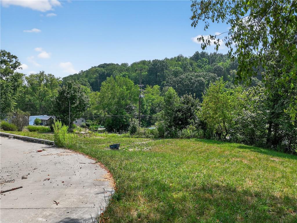 3143 Santiago Road Imperial, PA 15126 - Photo 11 of 24 a view of a grassy field with trees in the background