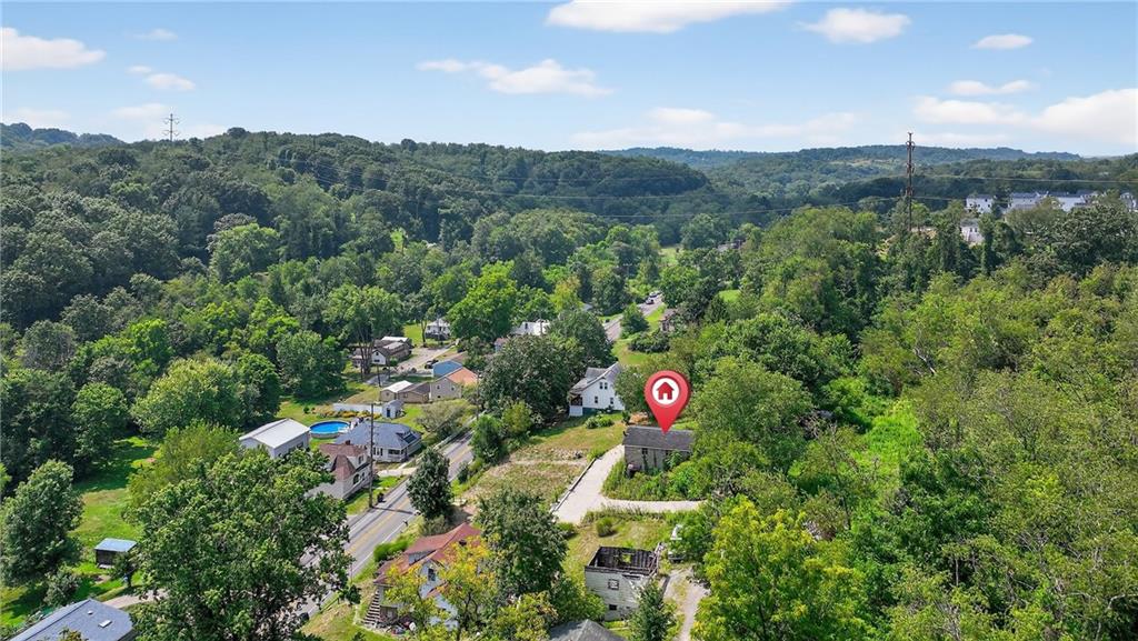 3143 Santiago Road Imperial, PA 15126 - Photo 14 of 24 a view of a lush green field with lots of bushes