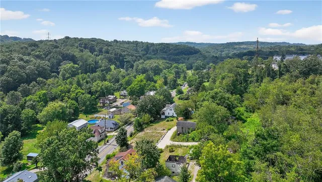 an aerial view of a house with a garden