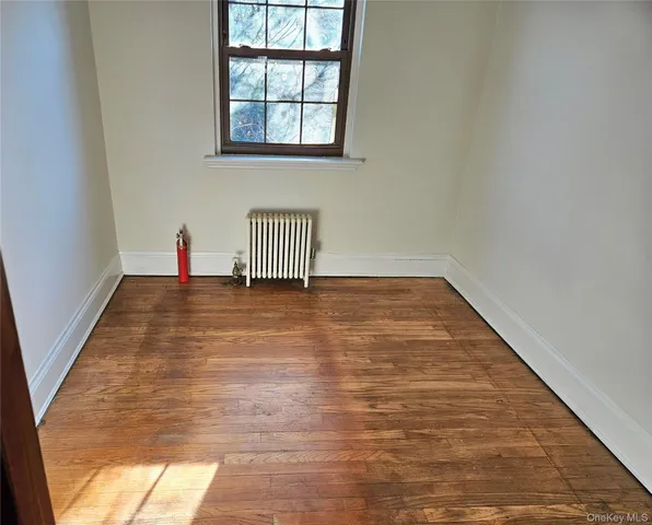 a living room with a couch and a lamp