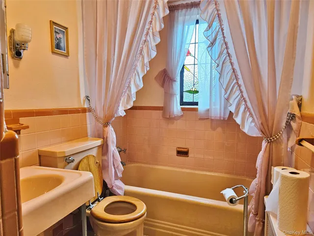 a living room with furniture a lamp and a fireplace