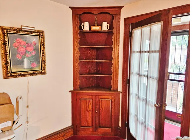 a view of a living room with furniture and a fireplace