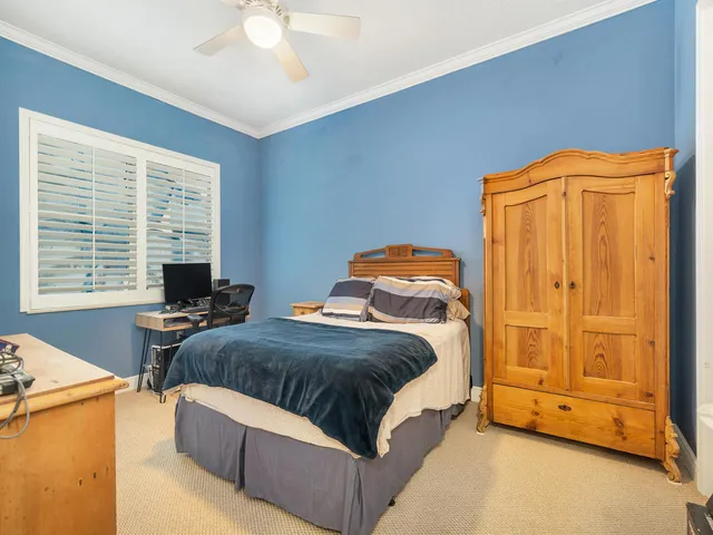 a bedroom with bed and window