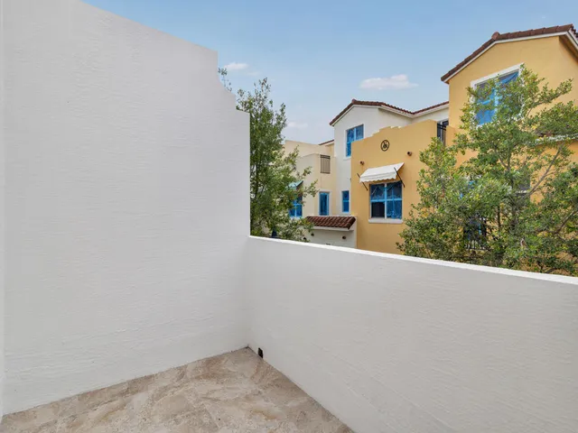 a view of a house with a small yard