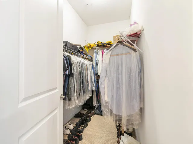 a bathroom with a shower a toilet and a sink