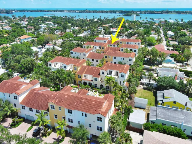 a view of sign board with plants