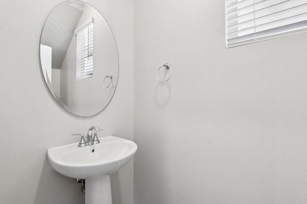 28424 Campos De Flores Temecula, CA 92591 - Photo 17 of 36 a bathroom with a sink a mirror and vanity