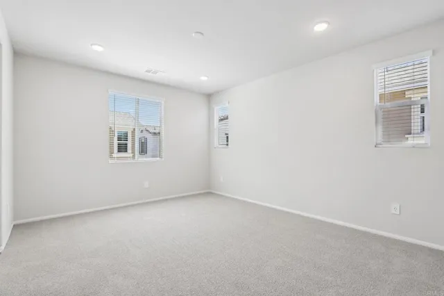 an empty room with windows