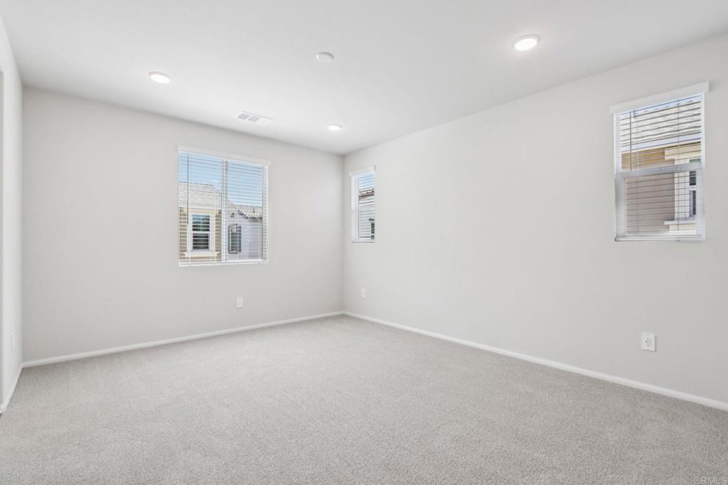 28424 Campos De Flores Temecula, CA 92591 - Photo 25 of 36 an empty room with windows