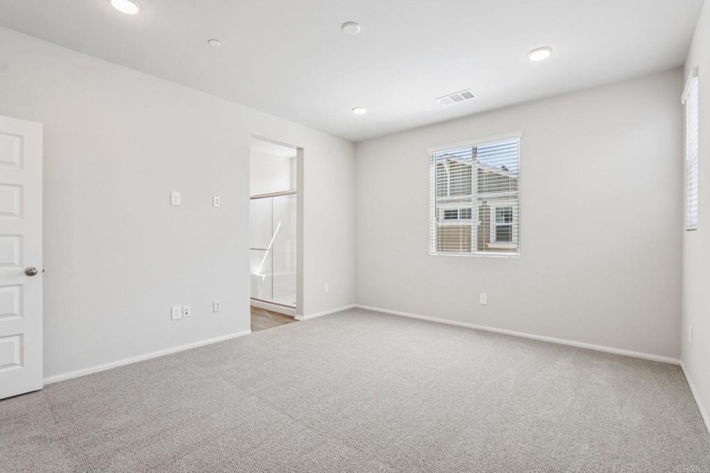 28424 Campos De Flores Temecula, CA 92591 - Photo 26 of 36 an empty room with windows