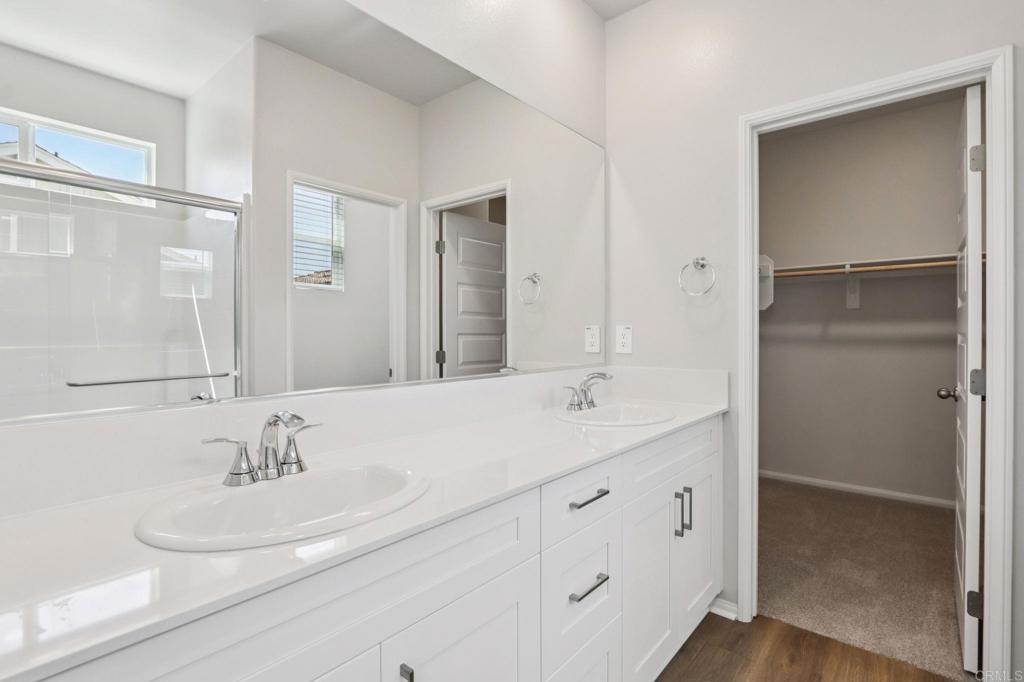 28424 Campos De Flores Temecula, CA 92591 - Photo 29 of 36 a bathroom with a sink and a mirror