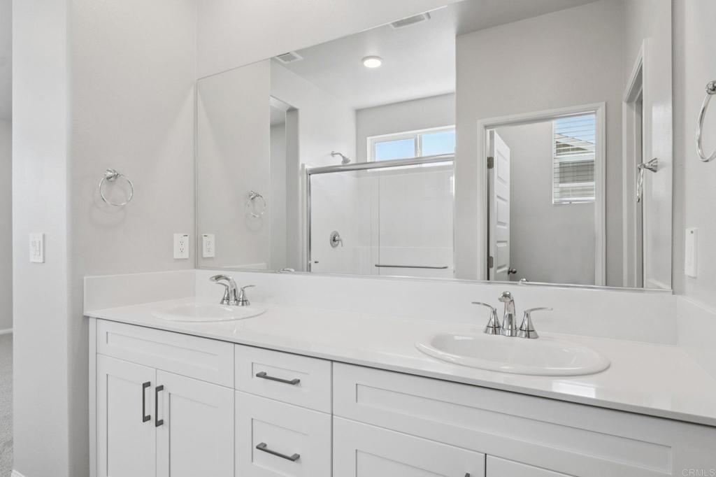 28424 Campos De Flores Temecula, CA 92591 - Photo 31 of 36 a bathroom with a sink and a mirror