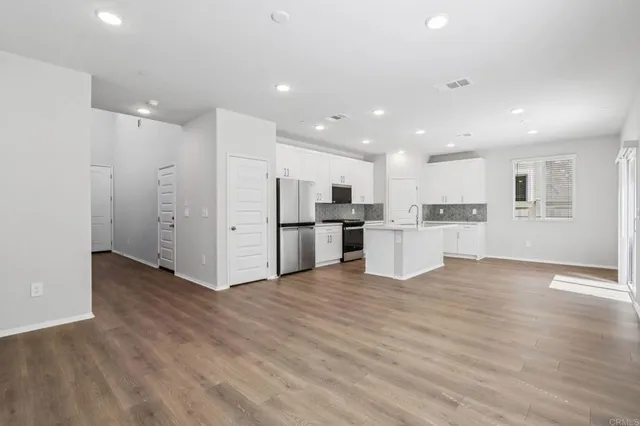 a view of kitchen with wooden floor