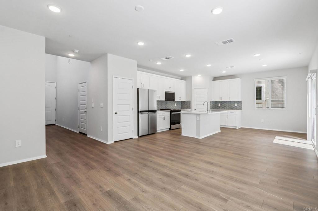 28424 Campos De Flores Temecula, CA 92591 - Photo 5 of 36 a view of kitchen with wooden floor