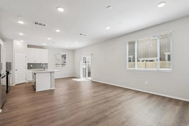 a view of kitchen with wooden floor