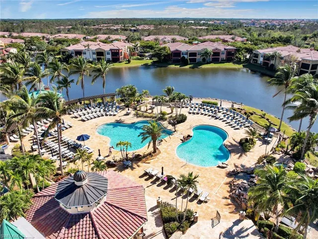an aerial view of a house with a lake view