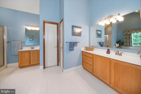 a spacious bathroom with a tub and sink