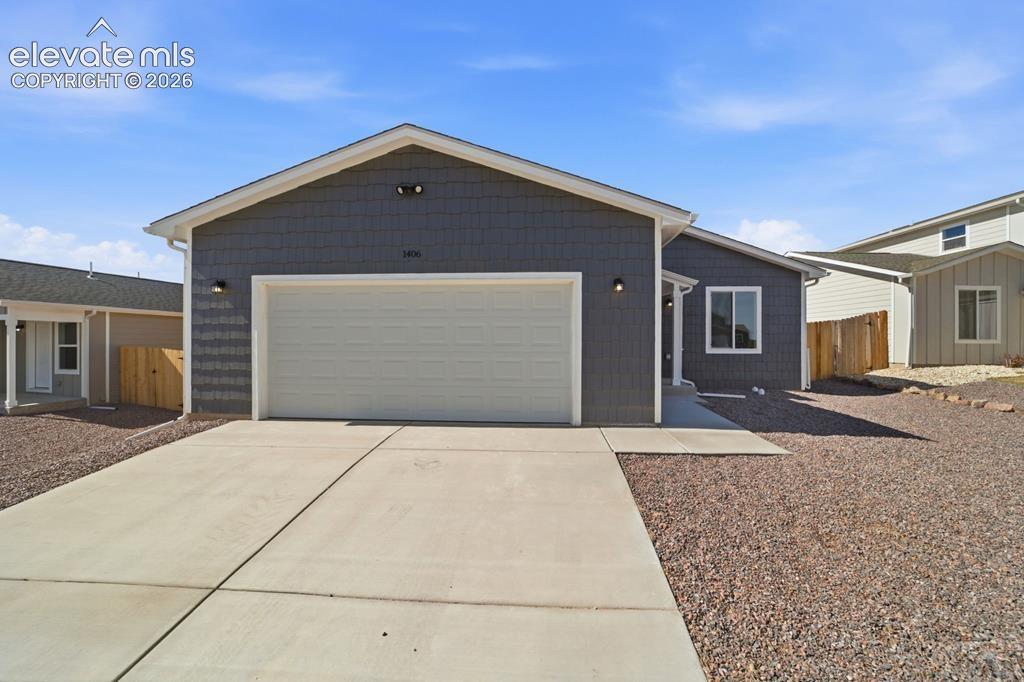 1406 Brewery Road Pueblo, CO 81001 - Photo 1 of 1 a front view of a house with a yard
