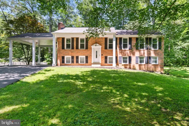 a front view of a house with a yard table and chairs