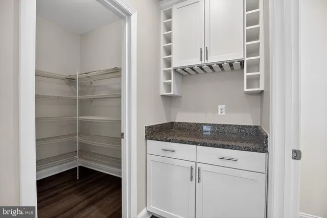 a kitchen with a cabinets and a stove