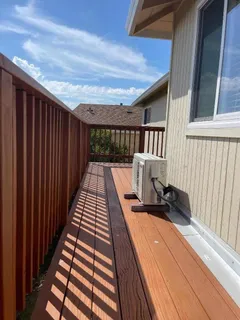 a view of balcony with wooden floor