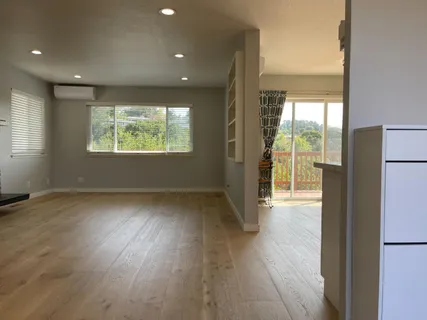 a view of an empty room and window