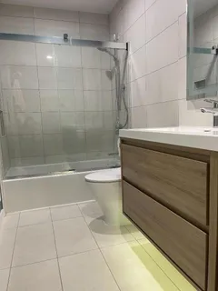 a bathroom with a bathtub and a shower
