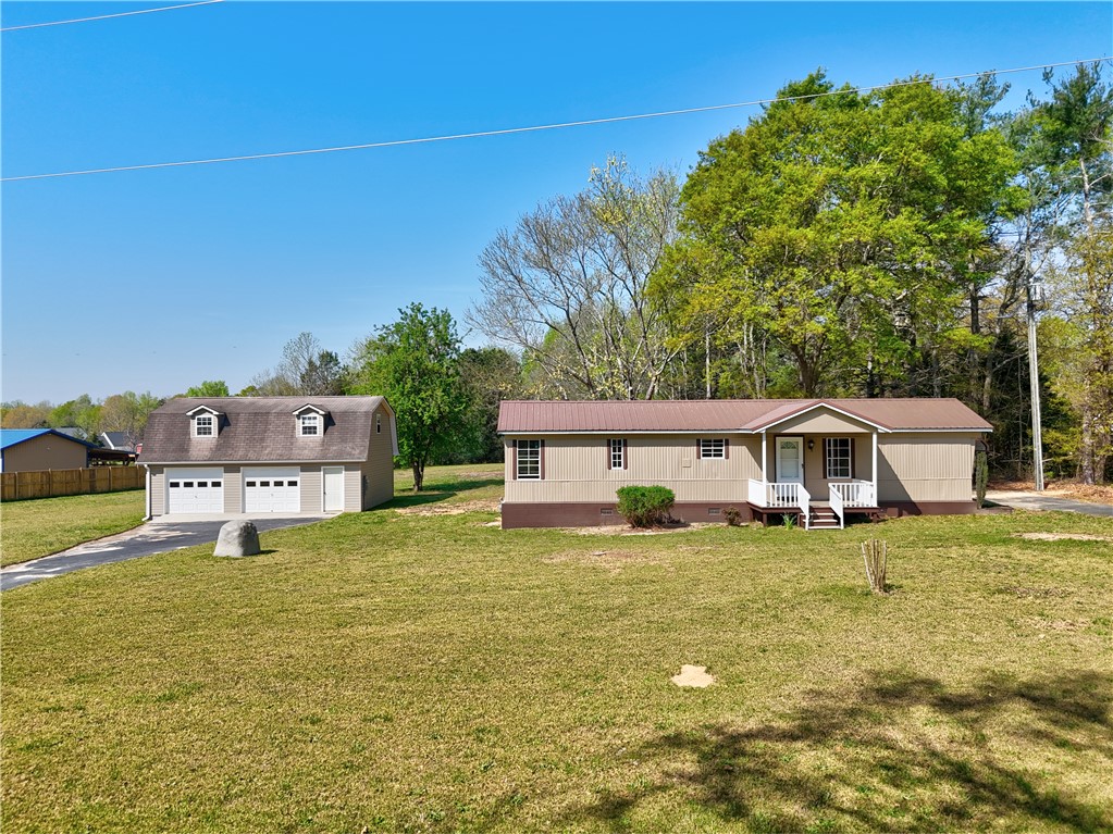 This charming home features a detached garage, offering ample space and convenience.