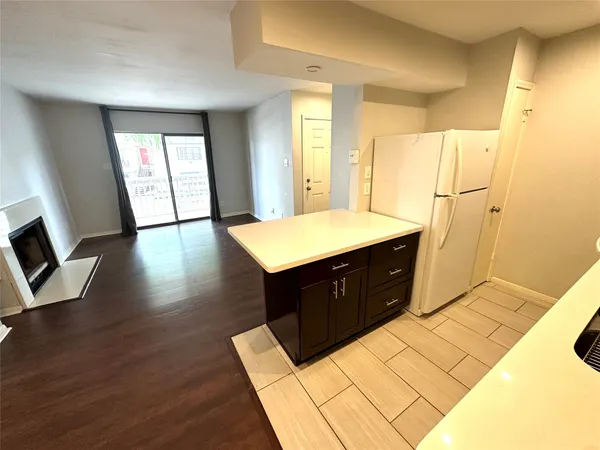 a room with a bed and a television