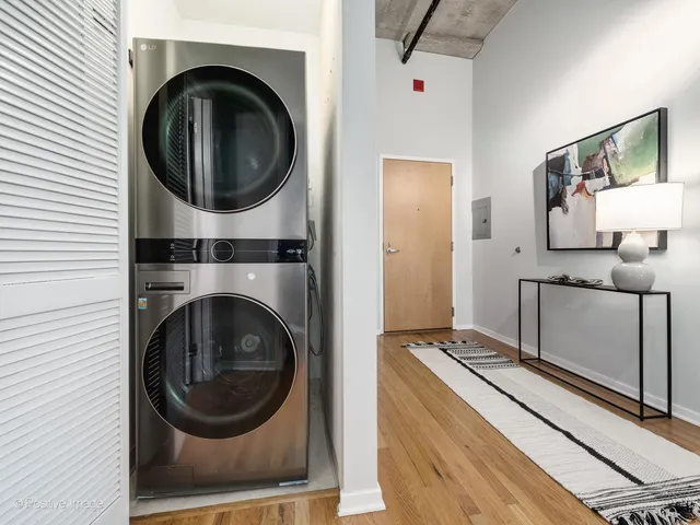a view of a storage and utility room with washer and dryer