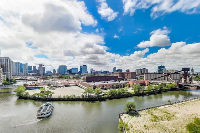 a view of a lake with a city in the background