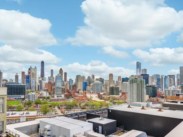 a view of a city with tall buildings