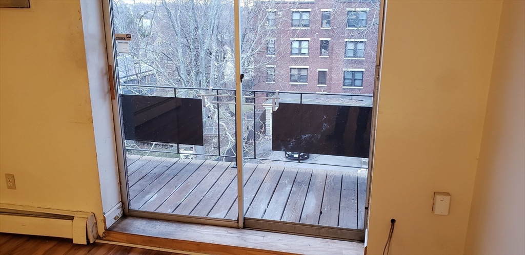 6 Hayes Road, Unit 25 Boston, MA 02131 - Photo 17 of 39 a room with a fireplace