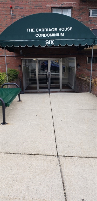 6 Hayes Road, Unit 25 Boston, MA 02131 - Photo 23 of 39 a front view of a house with a garage
