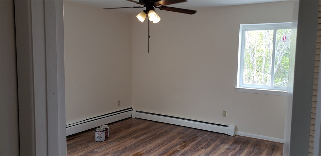 6 Hayes Road, Unit 25 Boston, MA 02131 - Photo 24 of 39 a view of an empty room with wooden floor and a window