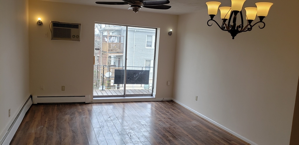 6 Hayes Road, Unit 25 Boston, MA 02131 - Photo 29 of 39 a view of a livingroom with wooden floor