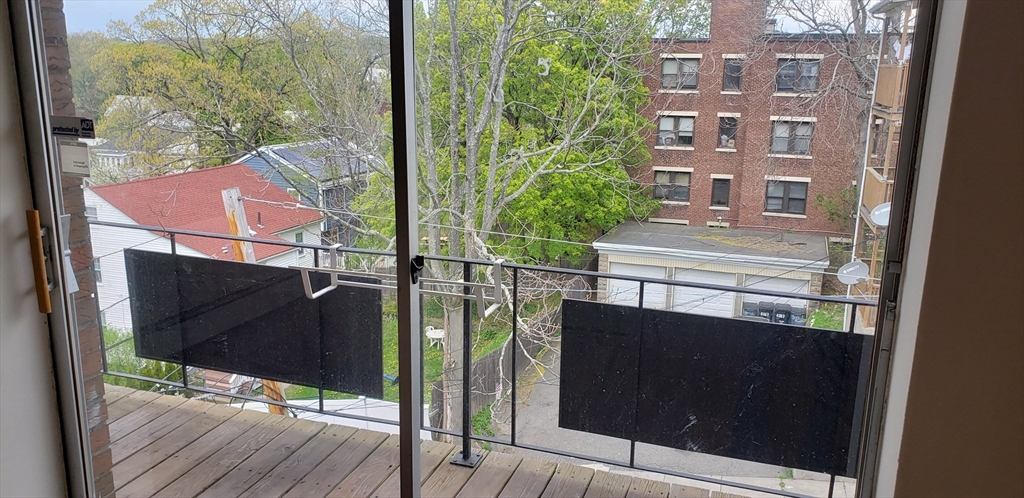 6 Hayes Road, Unit 25 Boston, MA 02131 - Photo 31 of 39 a view of balcony with wooden floor