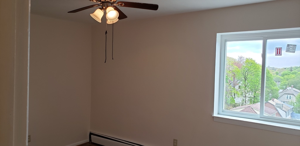 6 Hayes Road, Unit 25 Boston, MA 02131 - Photo 32 of 39 a view of room with window and chandelier fan