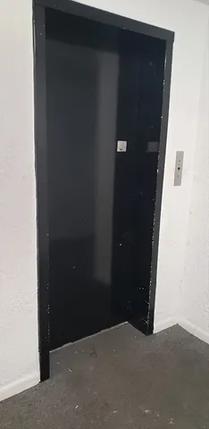 a view of a entryway with wooden floor