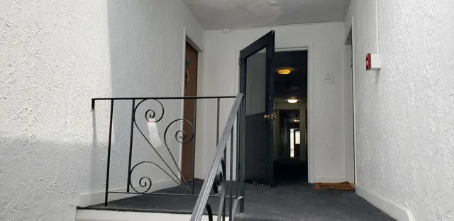 a view of entryway with wooden floor